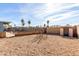 The backyard has low-maintenance gravel landscaping, a block wall, and mature palm trees at 3801 W Barnes Ln, Phoenix, AZ 85051