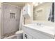 Bathroom featuring marble shower and vanity with stone tile flooring at 3801 W Barnes Ln, Phoenix, AZ 85051