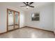 Bedroom with tile flooring and a sliding mirror door closet at 3801 W Barnes Ln, Phoenix, AZ 85051