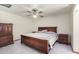 Spacious bedroom with a large wooden bed frame at 3801 W Barnes Ln, Phoenix, AZ 85051