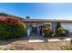 Inviting home entrance framed by a colorful bougainvillea and desert landscaping at 3801 W Barnes Ln, Phoenix, AZ 85051