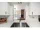 Stylish kitchen sink area overlooking a brick fireplace and a refreshing pool view at 3801 W Barnes Ln, Phoenix, AZ 85051