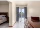 View of the main bedroom with a large dresser and access to the backyard at 3801 W Barnes Ln, Phoenix, AZ 85051