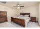 Main bedroom featuring a ceiling fan and tile flooring at 3801 W Barnes Ln, Phoenix, AZ 85051
