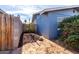 Small side yard with a young tree and wood fence at 3801 W Barnes Ln, Phoenix, AZ 85051