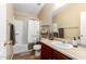 Bathroom with a tub, shower, and wood vanity at 40061 W Sanders Way, Maricopa, AZ 85138