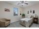 Bright bedroom featuring a twin bed, armchair, and city-themed art at 4103 E Mead Way, Chandler, AZ 85249