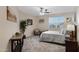 Serene bedroom with a queen bed, chair, and window coverings at 4103 E Mead Way, Chandler, AZ 85249