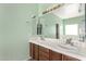 Double vanity bathroom with large mirror and updated fixtures at 41405 W Cielo Ln, Maricopa, AZ 85138