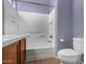 Bathroom with a toilet and bathtub shower combo at 41405 W Cielo Ln, Maricopa, AZ 85138