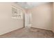 Simple bedroom with carpet flooring and window with shutters at 41405 W Cielo Ln, Maricopa, AZ 85138