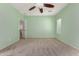 Bedroom with ceiling fan and access to upper level loft at 41405 W Cielo Ln, Maricopa, AZ 85138