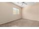 Simple bedroom with neutral walls and carpet at 41405 W Cielo Ln, Maricopa, AZ 85138