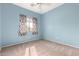 Bright bedroom with light blue walls and carpet flooring at 41405 W Cielo Ln, Maricopa, AZ 85138