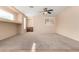 Primary bedroom with a ceiling fan and built-in shelving at 41405 W Cielo Ln, Maricopa, AZ 85138