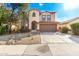 Two-story house with a large driveway and desert landscaping at 41405 W Cielo Ln, Maricopa, AZ 85138