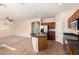 Kitchen with island, stainless steel appliances, and views to living room at 41405 W Cielo Ln, Maricopa, AZ 85138