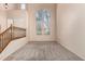 Living room featuring high ceilings and large windows at 41405 W Cielo Ln, Maricopa, AZ 85138