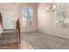 Spacious living room with high ceilings and large windows at 41405 W Cielo Ln, Maricopa, AZ 85138