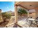 Covered patio with table and chairs at 41405 W Cielo Ln, Maricopa, AZ 85138