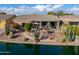 Single-story home with backyard patio and lake access at 42413 W Abbey Rd, Maricopa, AZ 85138