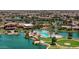 Aerial view of community pool and clubhouse near lake at 42413 W Abbey Rd, Maricopa, AZ 85138