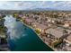 Aerial view of lakefront community with mountain views at 42413 W Abbey Rd, Maricopa, AZ 85138