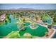 Aerial view of community with lake and mountain views at 42413 W Abbey Rd, Maricopa, AZ 85138