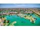 Aerial view of community with lake and resort-style pool at 42413 W Abbey Rd, Maricopa, AZ 85138