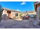 Patio features a fireplace, grill, and seating for entertaining at 42413 W Abbey Rd, Maricopa, AZ 85138