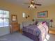 Bright bedroom with a comfortable bed and antique dresser at 42413 W Abbey Rd, Maricopa, AZ 85138