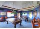 Game room with two pool tables and bar area at 42413 W Abbey Rd, Maricopa, AZ 85138