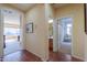 Well-lit hallway with access to bathroom and bedroom at 42413 W Abbey Rd, Maricopa, AZ 85138