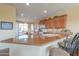 Kitchen with breakfast bar and granite countertops at 42413 W Abbey Rd, Maricopa, AZ 85138