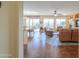 Spacious living room with tile floors and access to backyard at 42413 W Abbey Rd, Maricopa, AZ 85138