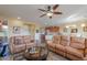 Spacious living room with comfortable leather sofas at 42413 W Abbey Rd, Maricopa, AZ 85138