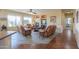 Relaxing living room with leather recliners and tile floors at 42413 W Abbey Rd, Maricopa, AZ 85138