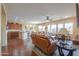 Open floor plan living room, kitchen and dining area at 42413 W Abbey Rd, Maricopa, AZ 85138