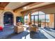 Relaxing lounge area with comfortable seating and access to a patio at 42413 W Abbey Rd, Maricopa, AZ 85138