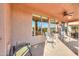 Relaxing covered patio with multiple seating areas at 42413 W Abbey Rd, Maricopa, AZ 85138