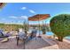 Relaxing patio area overlooking a lake, perfect for outdoor enjoyment at 42413 W Abbey Rd, Maricopa, AZ 85138