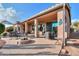 Spacious patio with seating area and fire pit at 42413 W Abbey Rd, Maricopa, AZ 85138