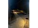 Exterior walkway with pathway lighting and decorative stone landscaping at 42413 W Abbey Rd, Maricopa, AZ 85138