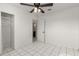 Bedroom with tiled floors, closet, and door to hallway at 4427 N 58Th Ave, Phoenix, AZ 85031