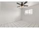 Bright bedroom with tiled floors and ceiling fan at 4427 N 58Th Ave, Phoenix, AZ 85031