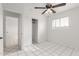 Bedroom with tiled floors and sliding door closet at 4427 N 58Th Ave, Phoenix, AZ 85031