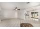 Open concept living room with kitchen and tile floors at 4427 N 58Th Ave, Phoenix, AZ 85031