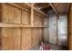 Exterior storage shed with wooden shelving at 4427 N 58Th Ave, Phoenix, AZ 85031