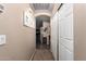 Bright hallway with access to kitchen and other rooms at 45331 W Applegate Rd, Maricopa, AZ 85139