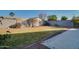 Landscaped backyard with grass and brick edging at 4872 E Sandwick Dr, San Tan Valley, AZ 85140